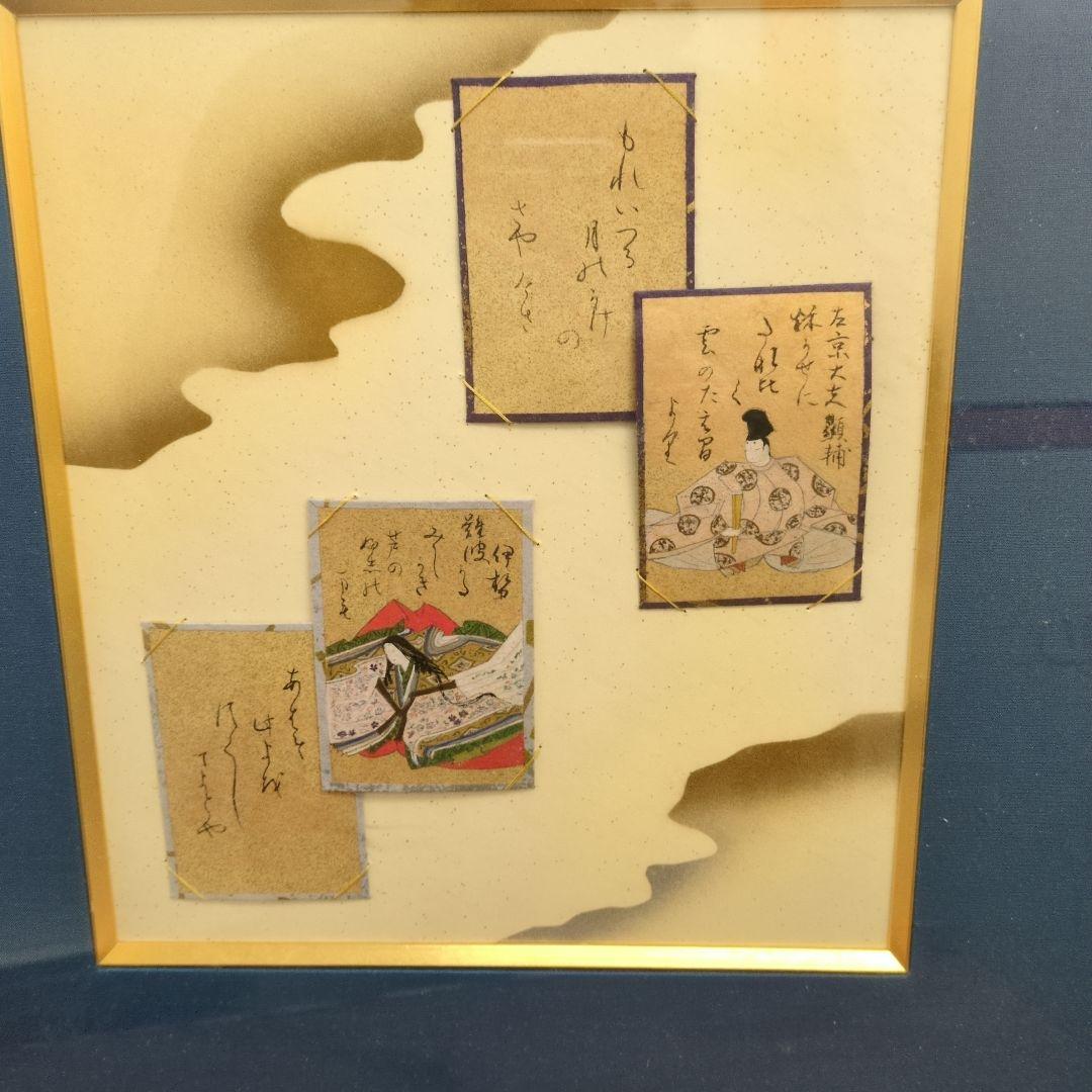 百人一首の古いカルタが読札と絵札のセットでマウントされています