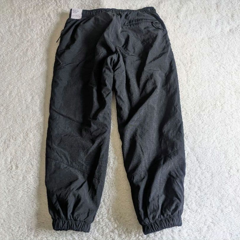 新品 NIKE ナイキ ナイロンウーブンパンツ 裏起毛