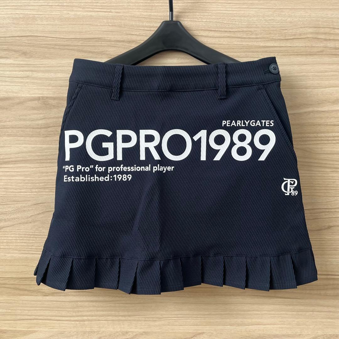 新品★28,600円 パーリーゲイツ 春夏ゴルフスカート 裾プリーツ 濃紺×白０